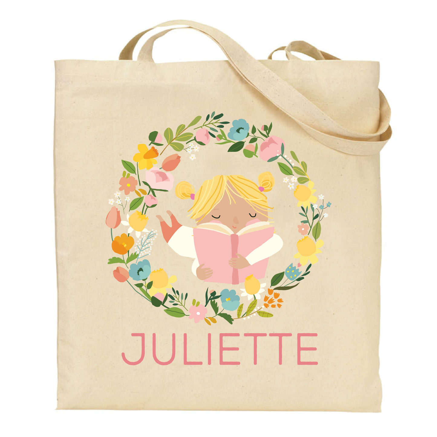 canvas tote bag with a design of a blonde girl reading a book surrounded by flowers and the name 'Juliette' on a white background.