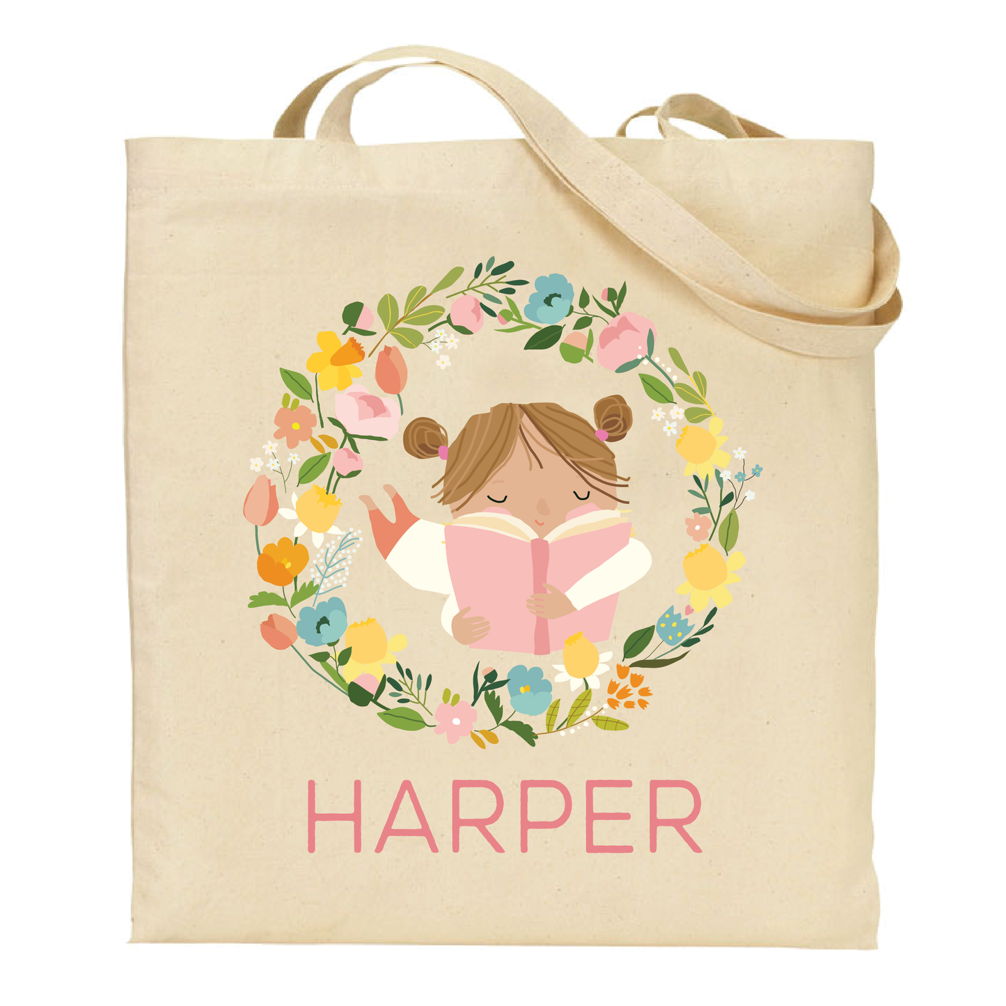 canvas tote bag with a brunette girl reading a book surrounded by flowers and the name 'Harper' on a white background.